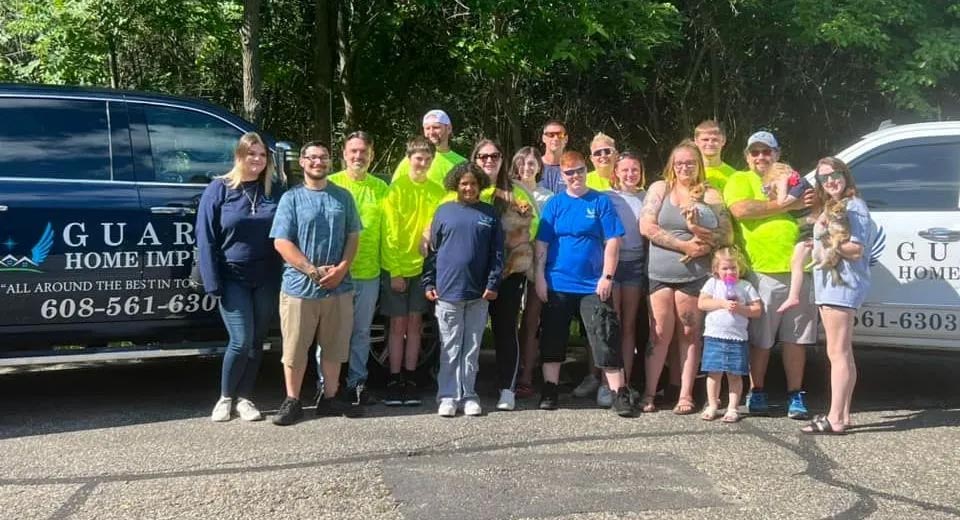 Group of workers in front of trucks in Southern Wisconsin